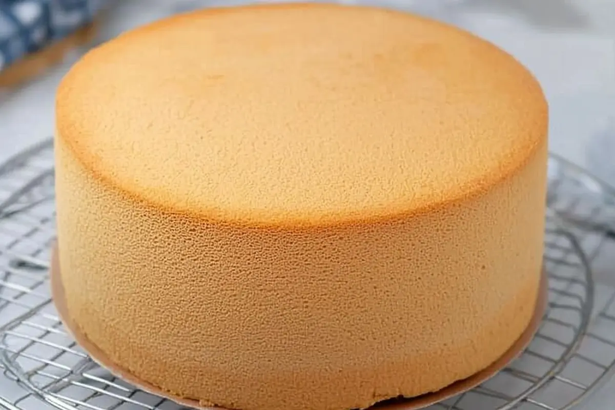 A sponge cake on a cake stand.