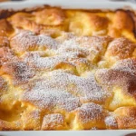 Peach cobbler dump cake in a baking dish.